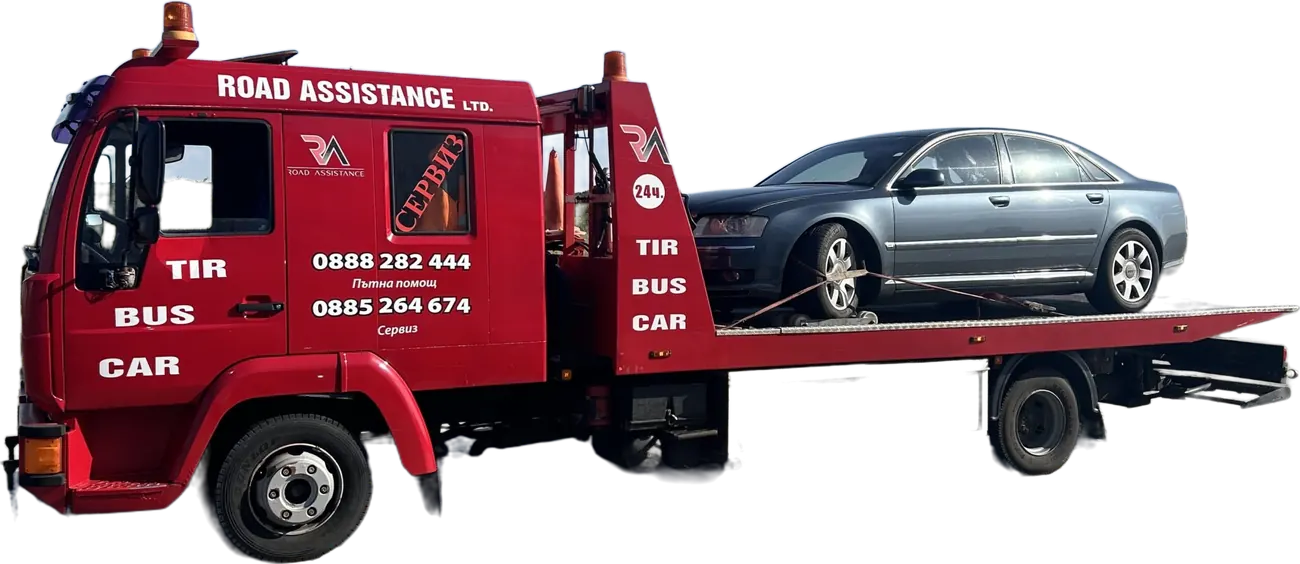 Червеният камион на Road Assistance с качена лимузина